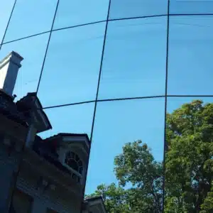 Mirror windows of building reflect blue sky